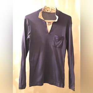 Descente, women’s ski turtleneck, purple & white w/logo in front zip. SZ M.